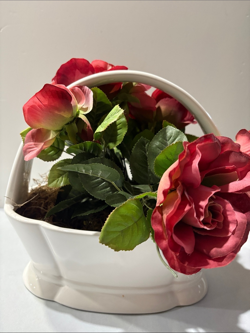 Rose Artificial Arrangement in White Ceramic Basket half moon bay California